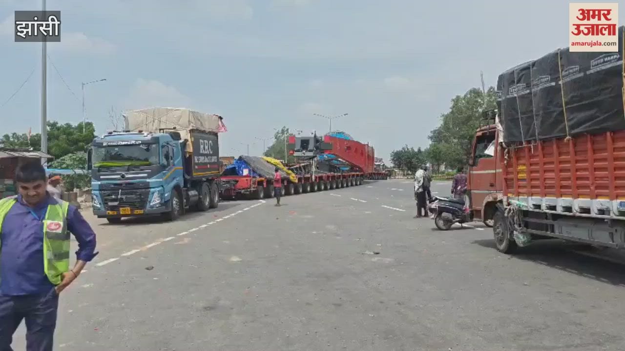 Video: You'll be dizzy counting the wheels of this truck...two drivers operate it simultaneously.