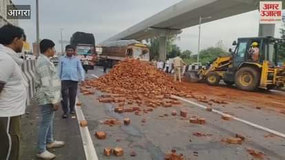 Traffic jam due to bricks fill trolley overturned on highway in Agra