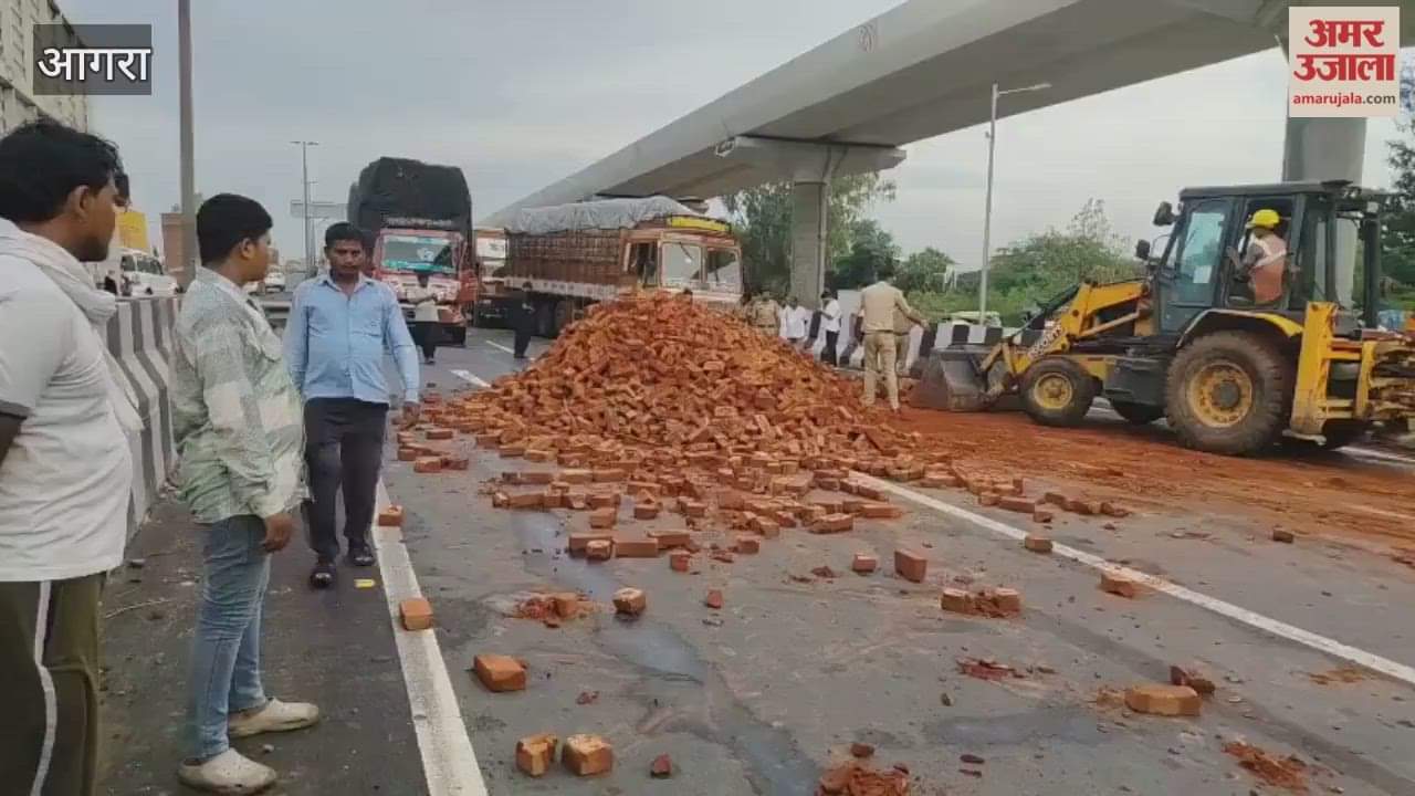Traffic jam due to bricks fill trolley overturned on highway in Agra