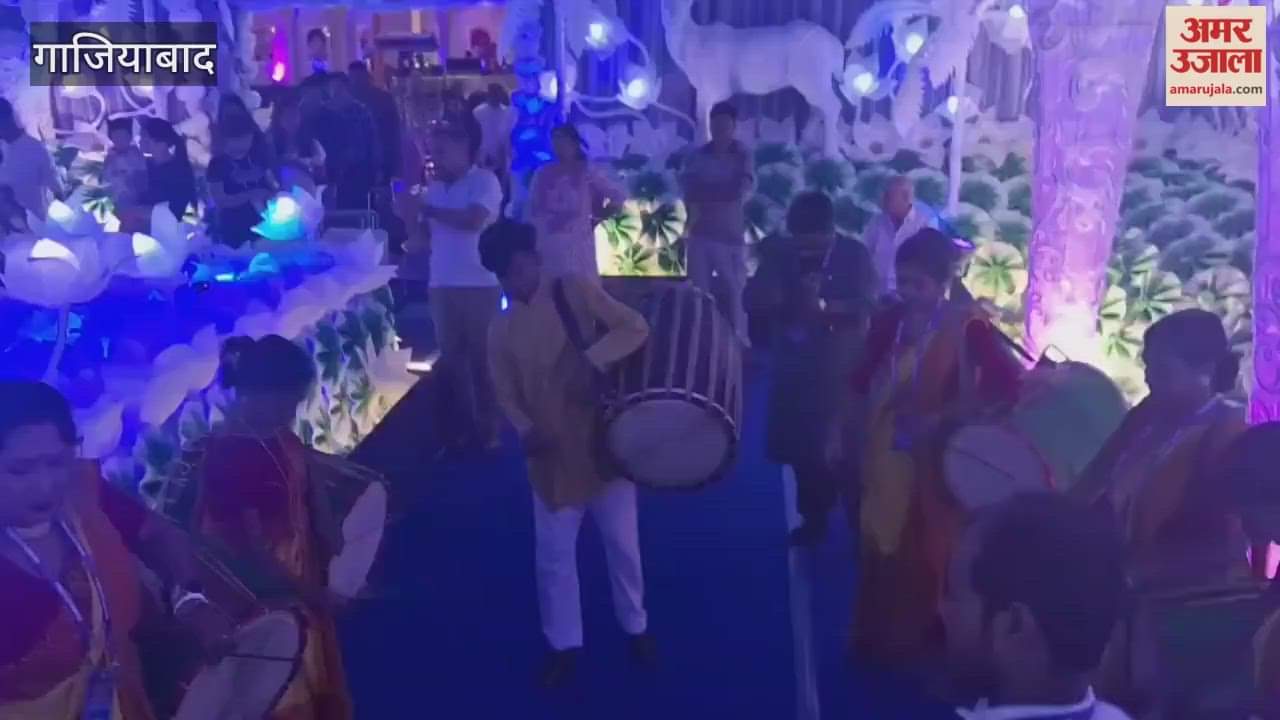 Bengali artists playing Dhak at the puja pandal organised by Bangotaru Puja Committee at Shipra Suncity Phase One