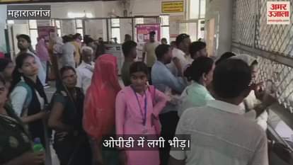 Crowd of patients in the district hospital, people are falling ill due to fever.