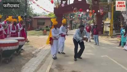 People danced to the beats of drums at the Surajkund Diwali Mela