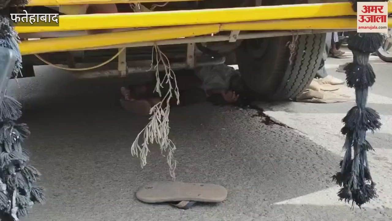 A man died after being hit by a school bus in Fatehabad; his body remained trapped under the tyre for 20 minutes.