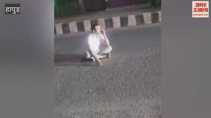 Drunk policeman creates ruckus while sitting in middle of road in Hapur
