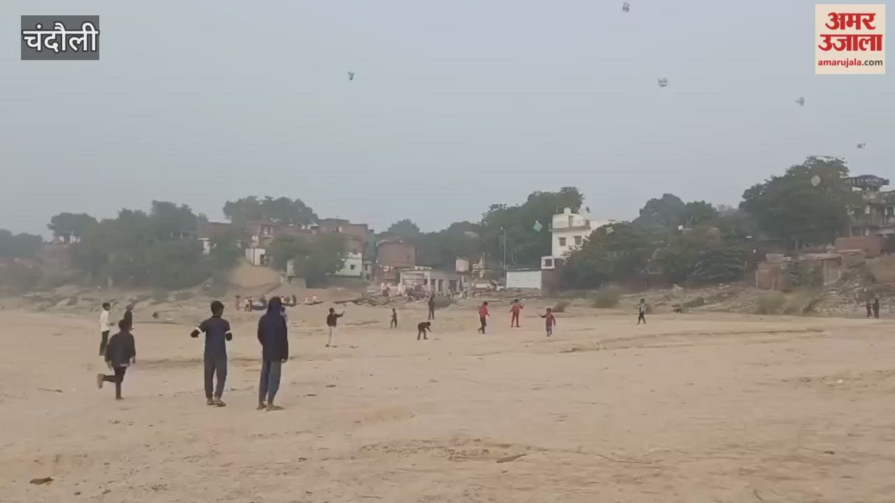 Children enjoyed sunshine by flying kites on banks of Ganges River