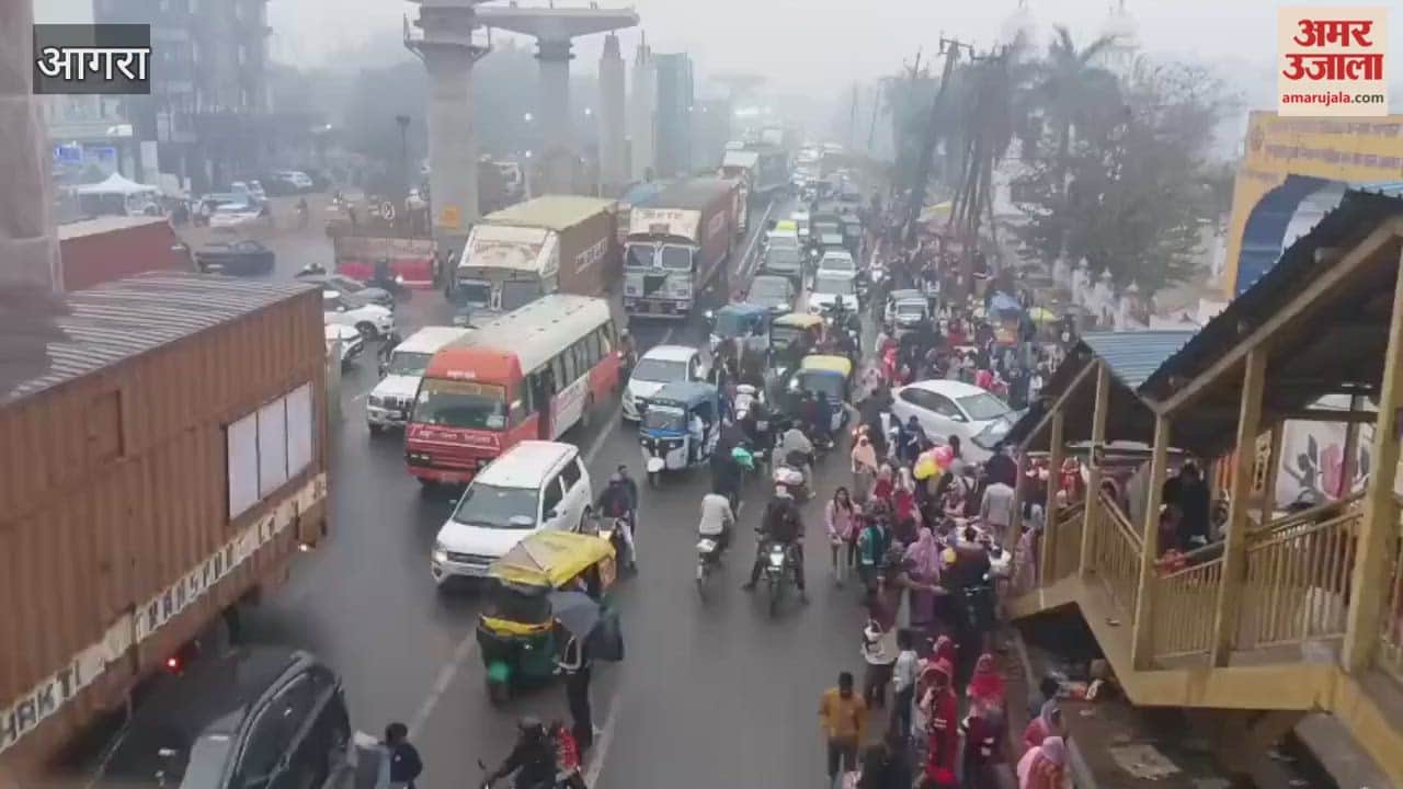 large crowd gathered at Gurdwara Guru Ka Tal on first day of new year causing long queue of vehicles on highway