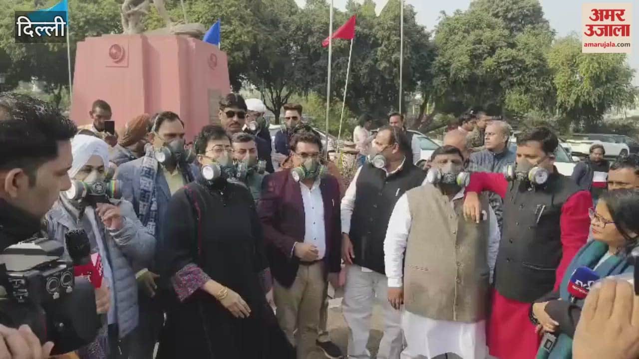 Aam Aadmi Party MLAs staged a protest outside the Delhi Assembly wearing masks