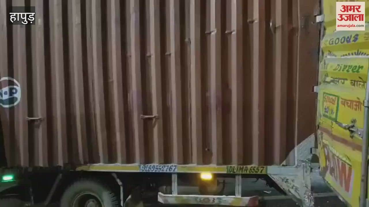 A canter truck collided with the back of another truck on the highway the driver was injured in Hapur