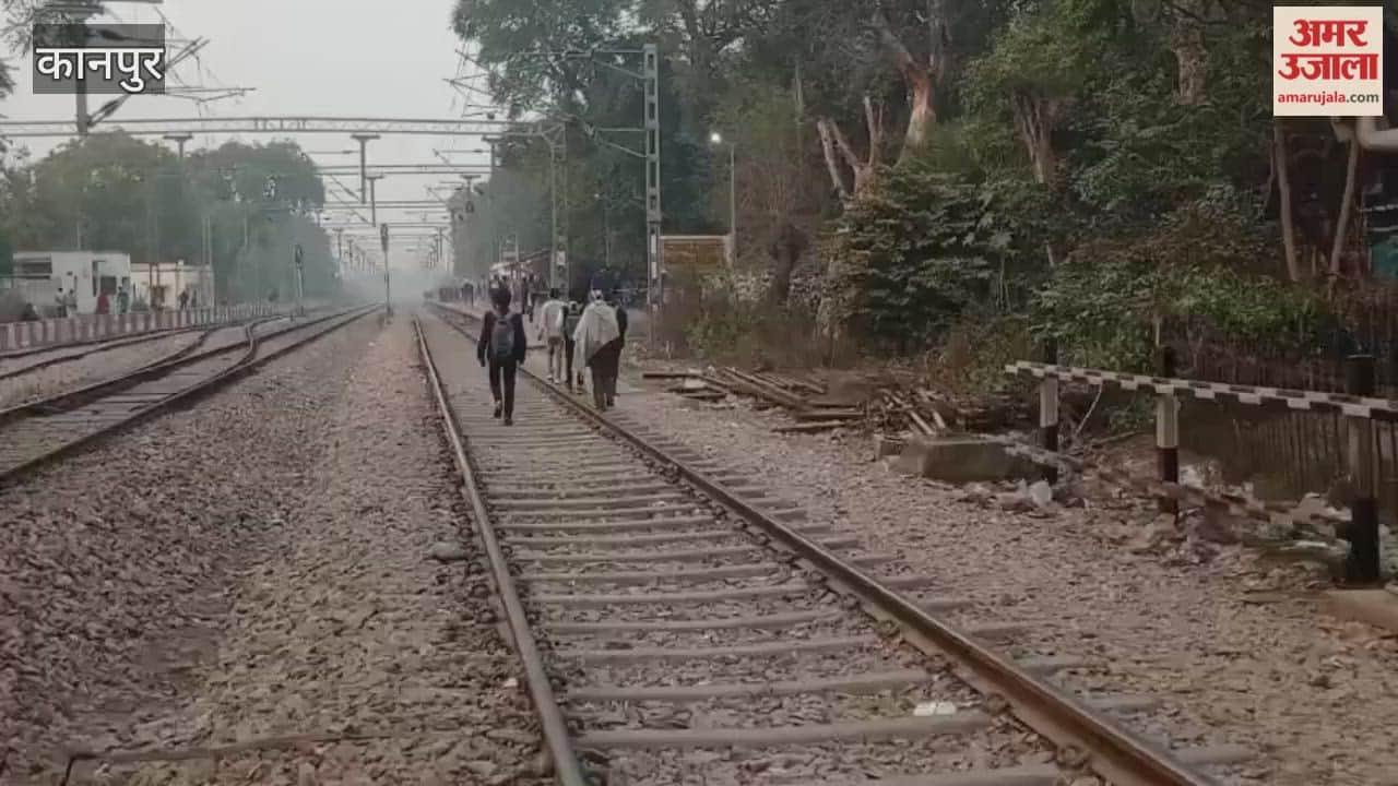 Kanpur: People risk their lives walking along the railway tracks to reach the station