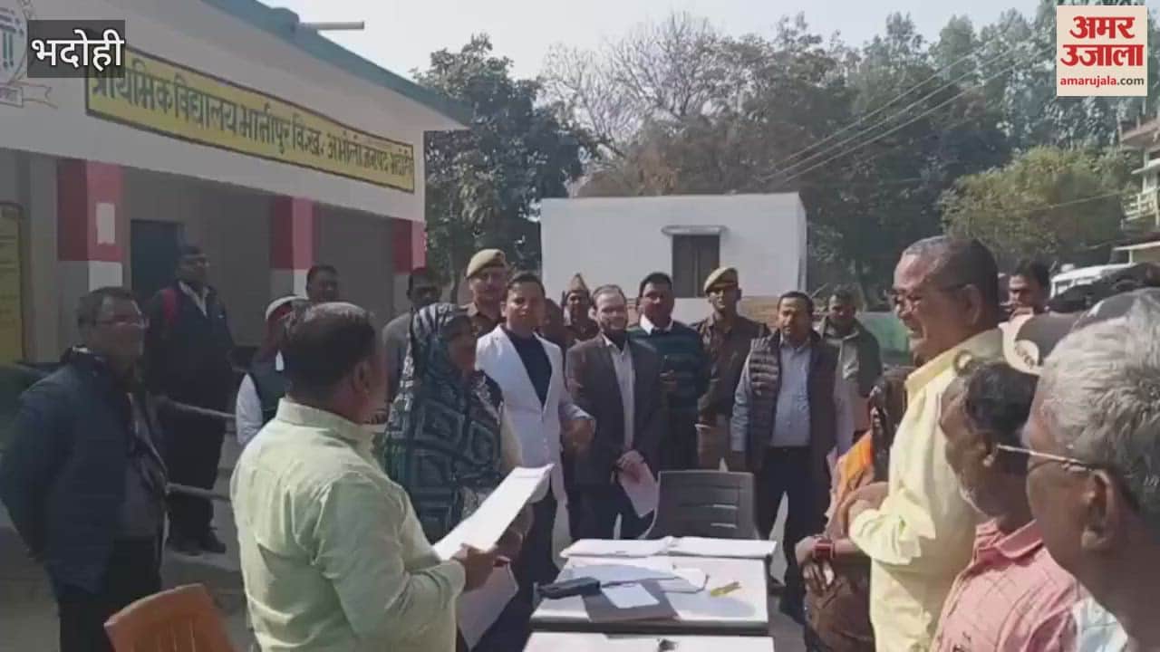 DM reaches polling booths in Bhadohi BLO reads voter list