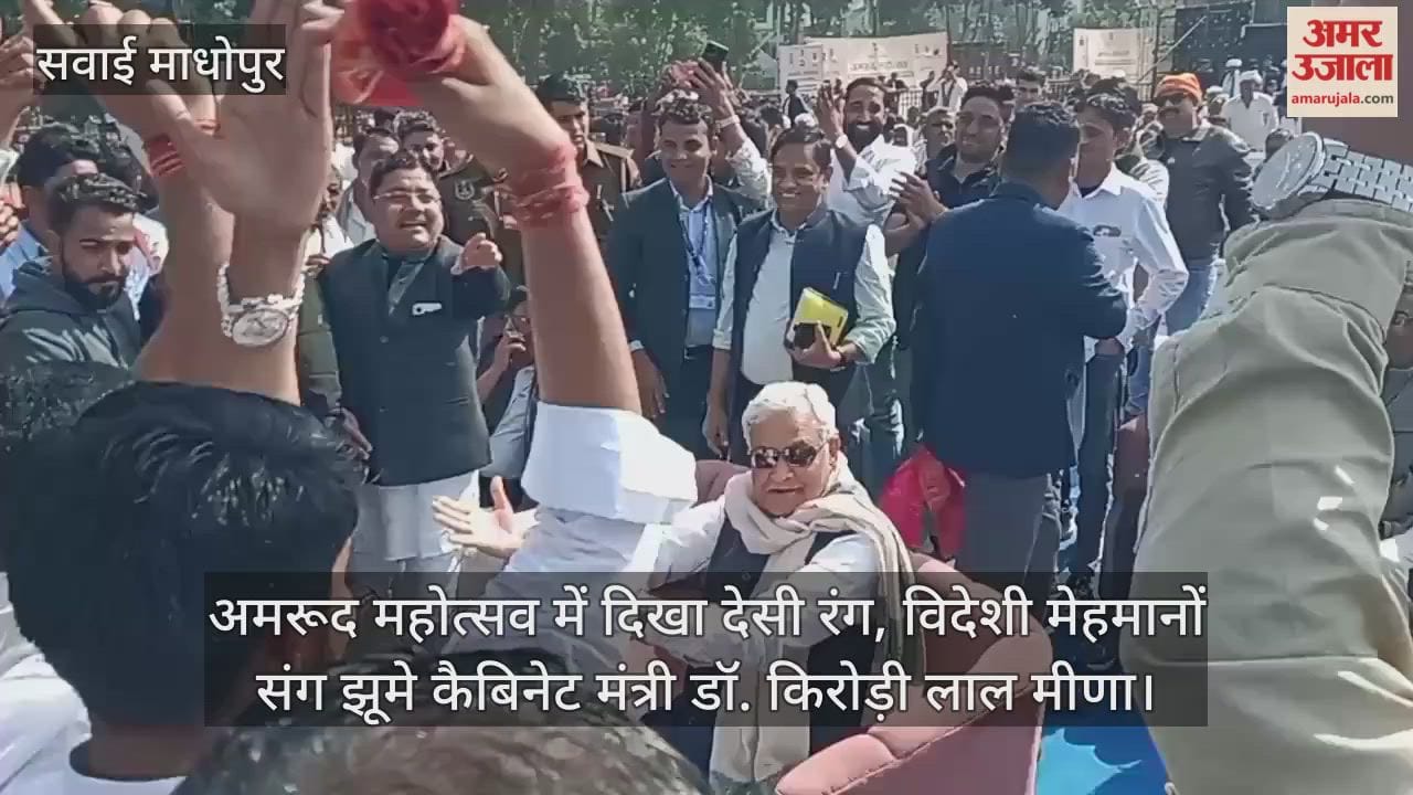 Cabinet minister Kirodi Lal Meena dances with foreign guests at Guava Festival in Sawai Madhopur