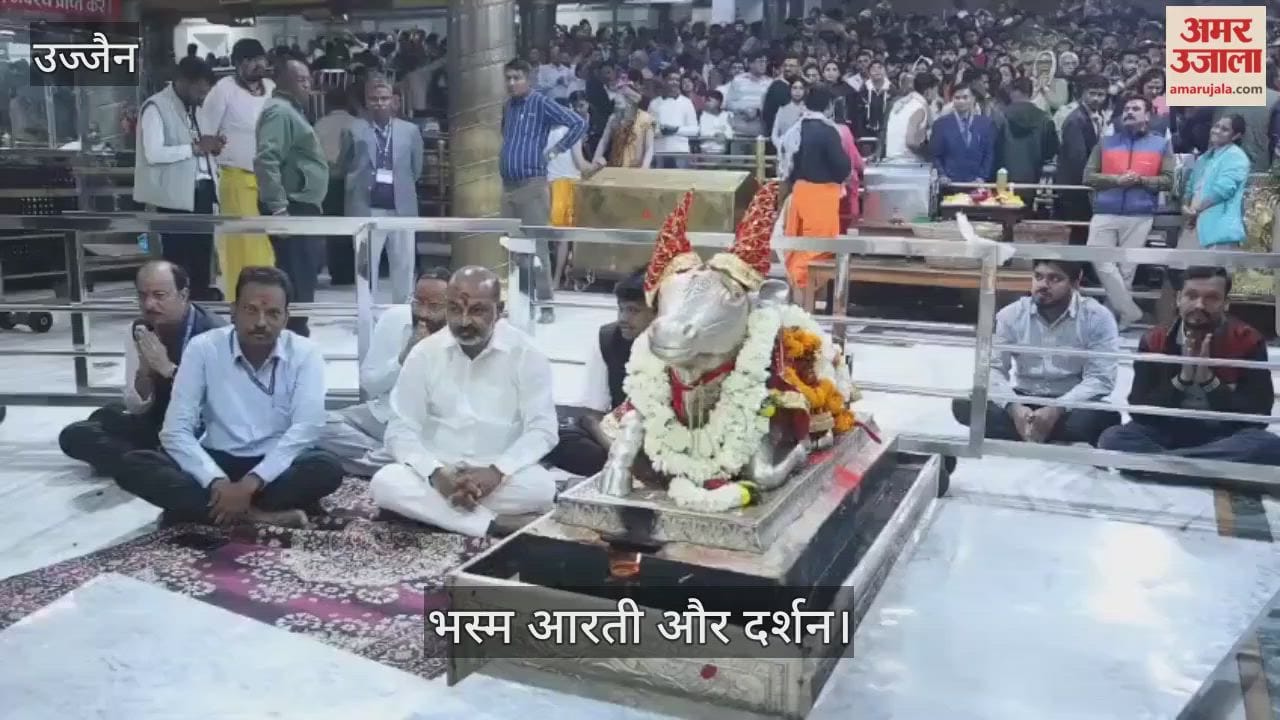 Baba Mahakal adorned moon forehead, a Tripundra neck garland lotuses during Bhasma Aarti.
