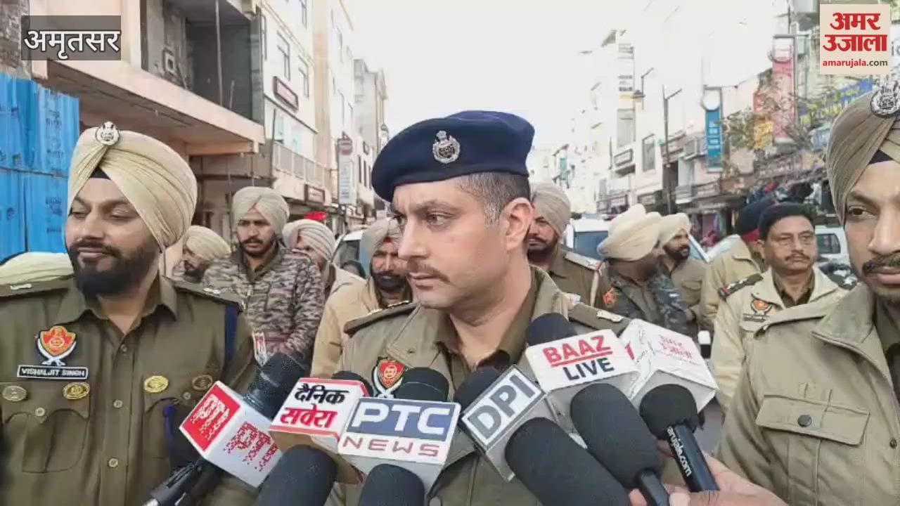 Police conduct a flag march in Hall Bazaar, Amritsar