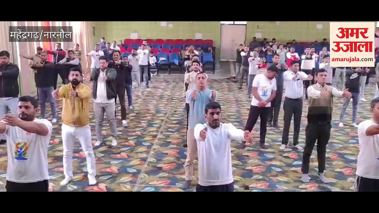 Hundreds of officers and employees performed Surya Namaskar (sun salutation) in an auditorium in Narnaul