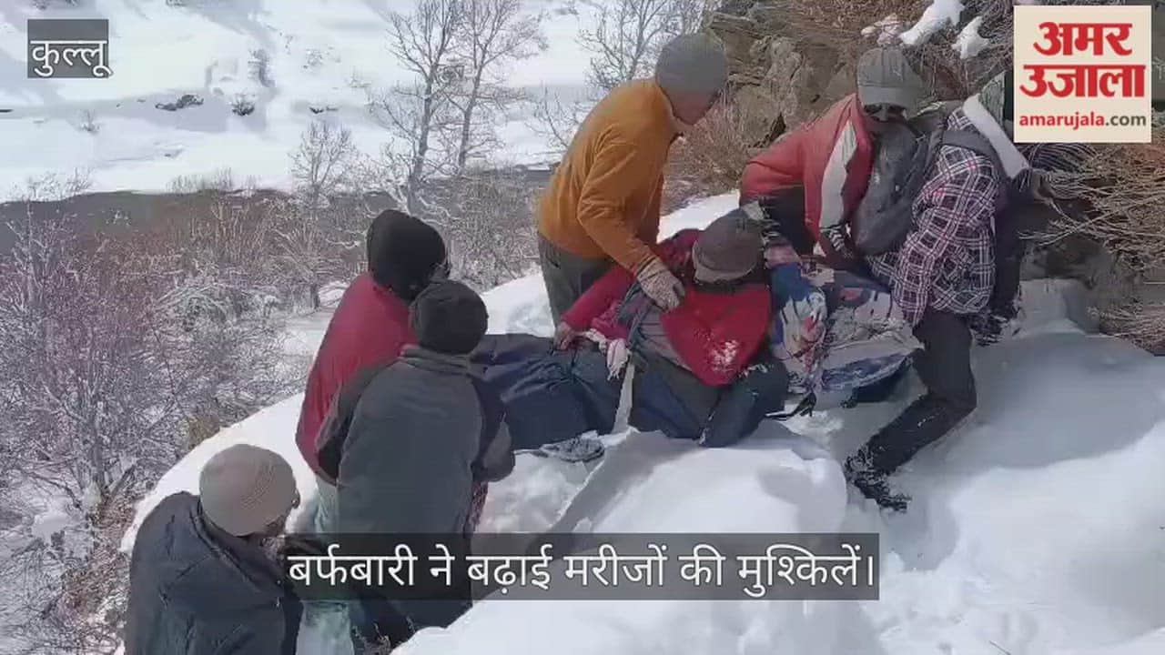 Keylong Snowfall increases difficulties for patients villagers carry a female patient to the road