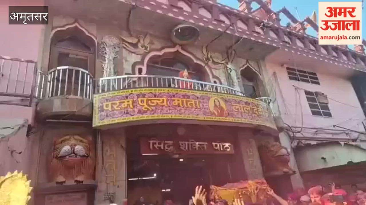 Devotees played Holi with colours outside Mata Lal Devi Temple in Amritsar.