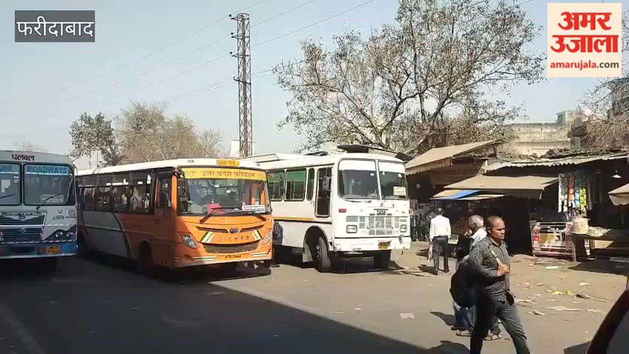 Video Buses parked on roadside outside Ballabhgarh bus stand block road