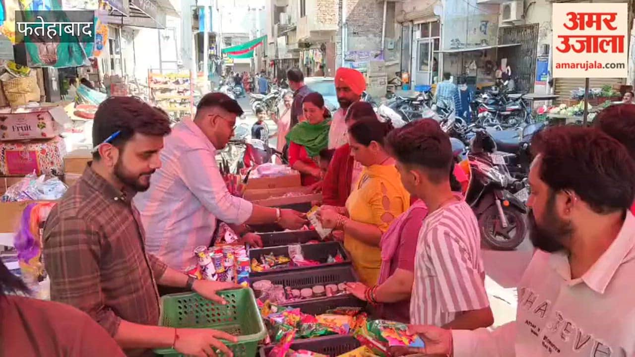 People shopped for the Holi festival
