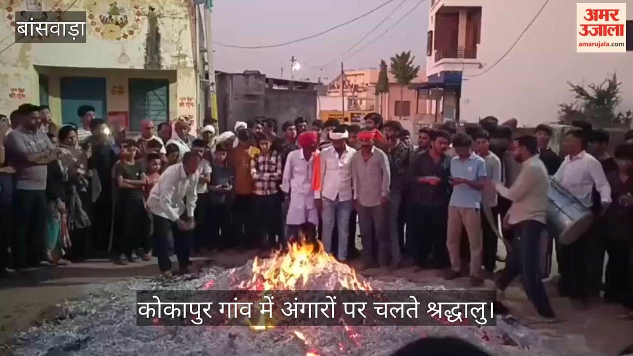 Devotees walk on burning embers in Kokapur on Holi