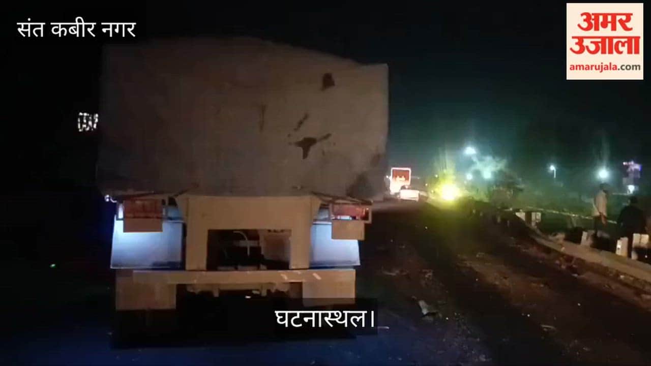 Car crosses divider and collides with trailer, driver injured