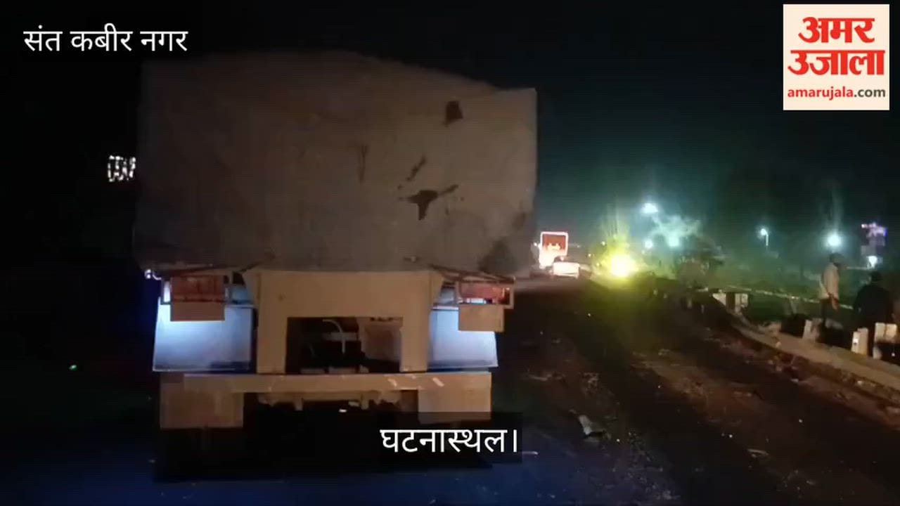 Car crosses divider and collides with trailer, driver injured
