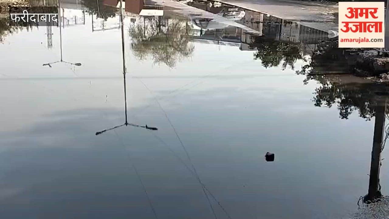 Drain water filled  road in Faridabad Sector 20A