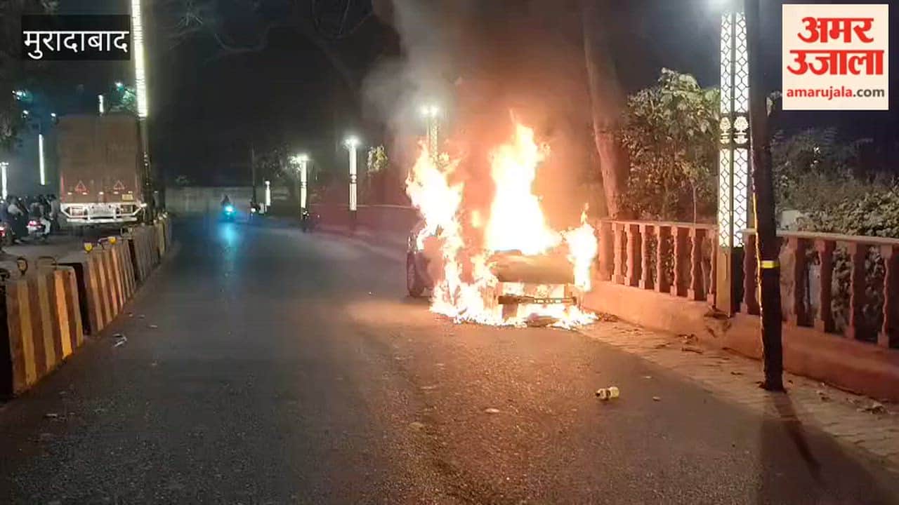 A moving car caught fire due to a short circuit on Delhi Road