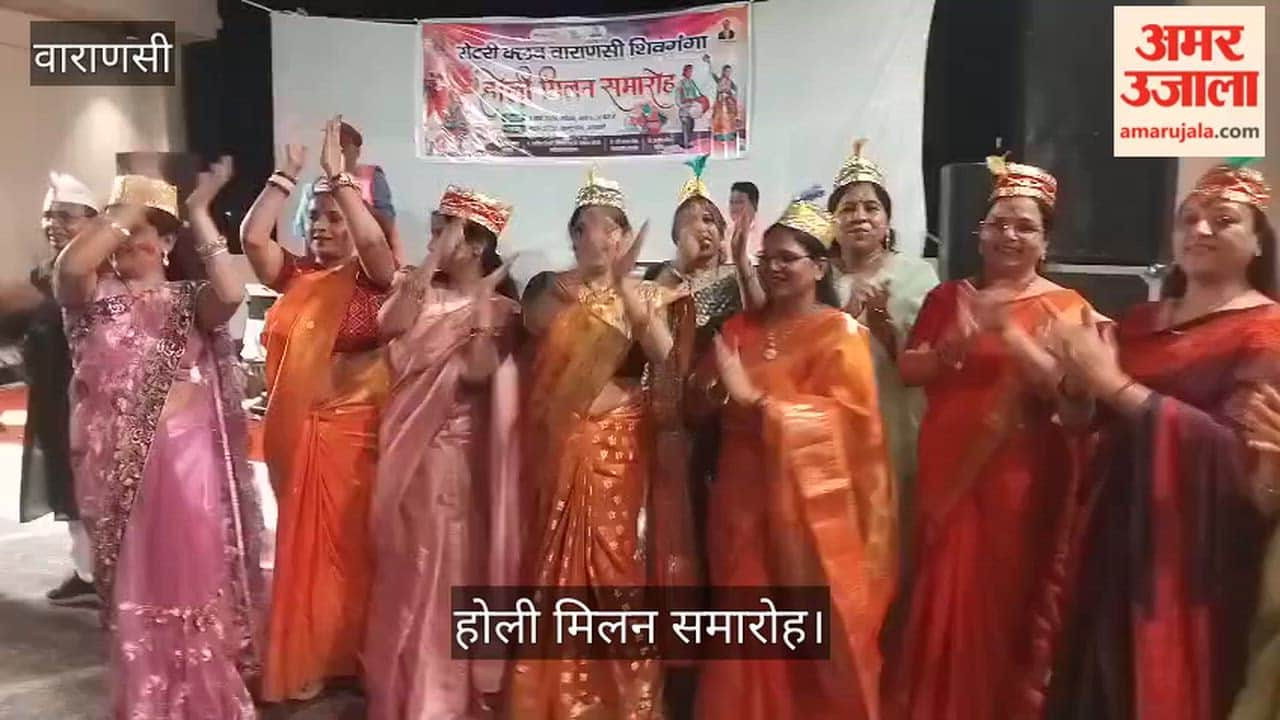 Women danced wildly at the Holi Milan celebration