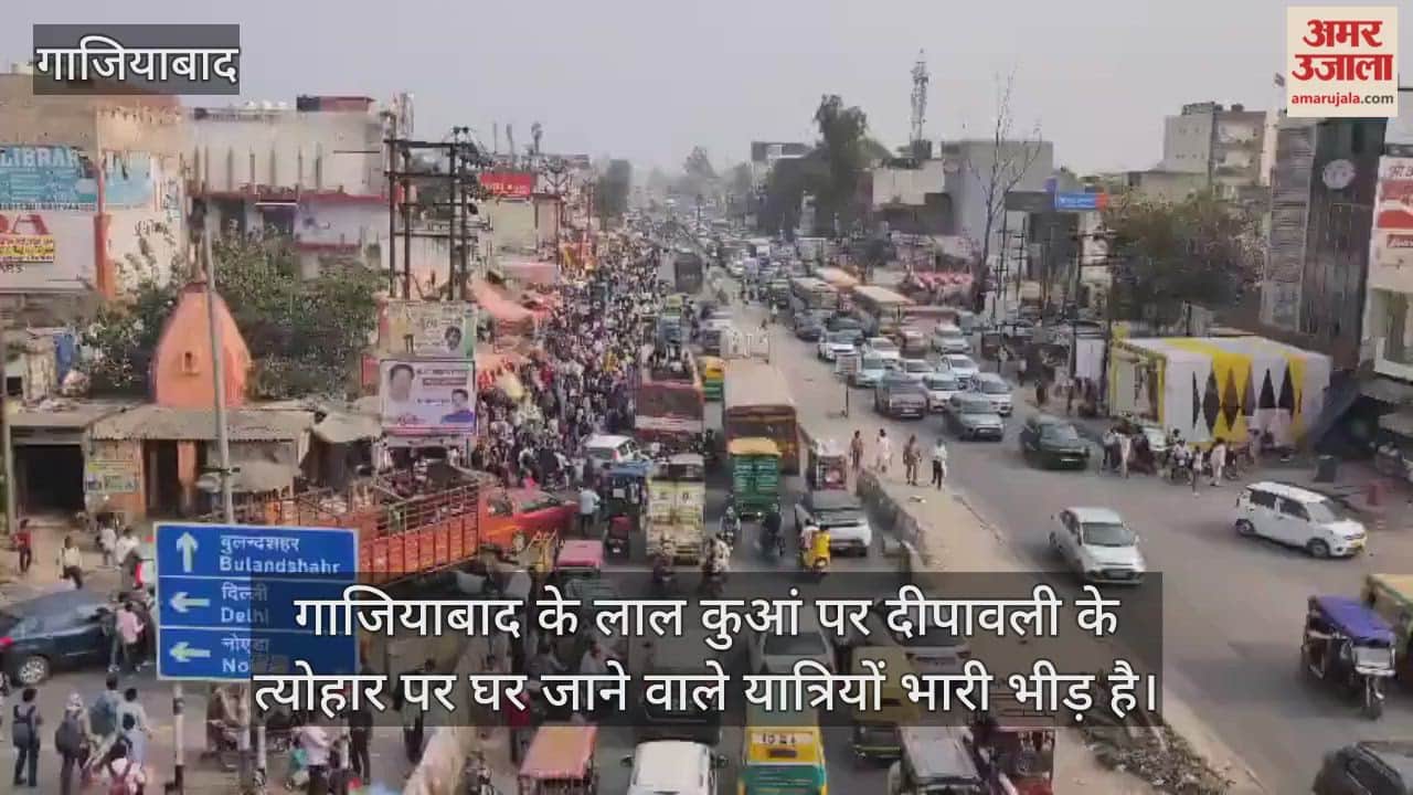 Traffic jam at Lal Kuan in Ghaziabad, people travelling on the roof of buses
