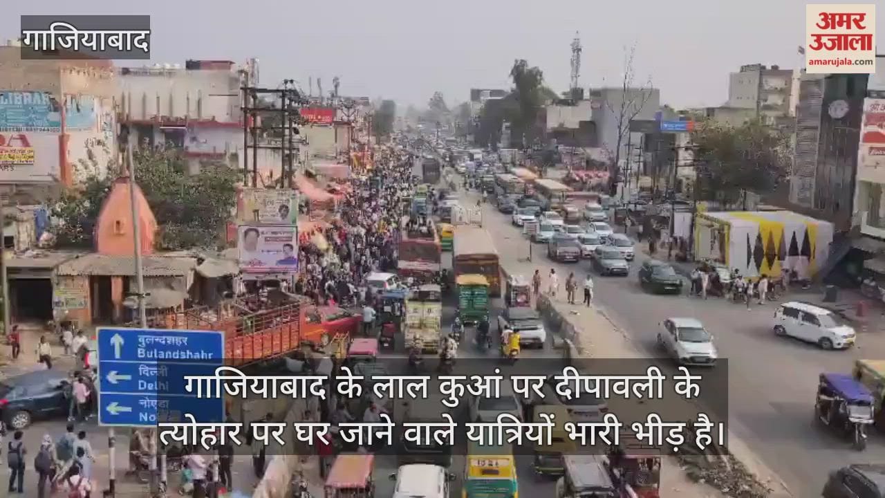 Traffic jam at Lal Kuan in Ghaziabad, people travelling on the roof of buses