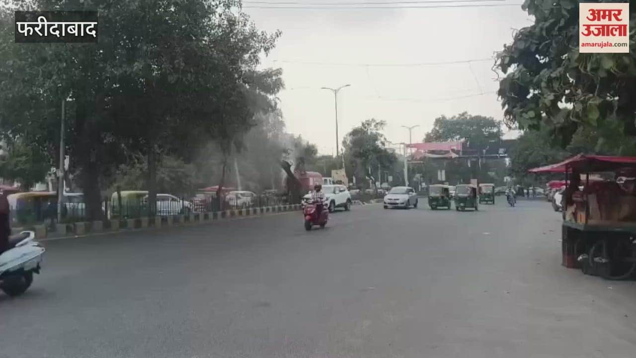 Municipal Corporation vehicle sprinkles water near Neelam BK Chowk on Gurgaon Road