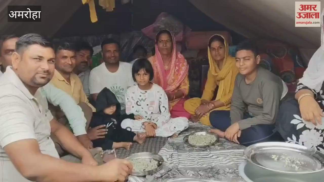 Devotees enjoying Khichdi at the Ganga Mela camps