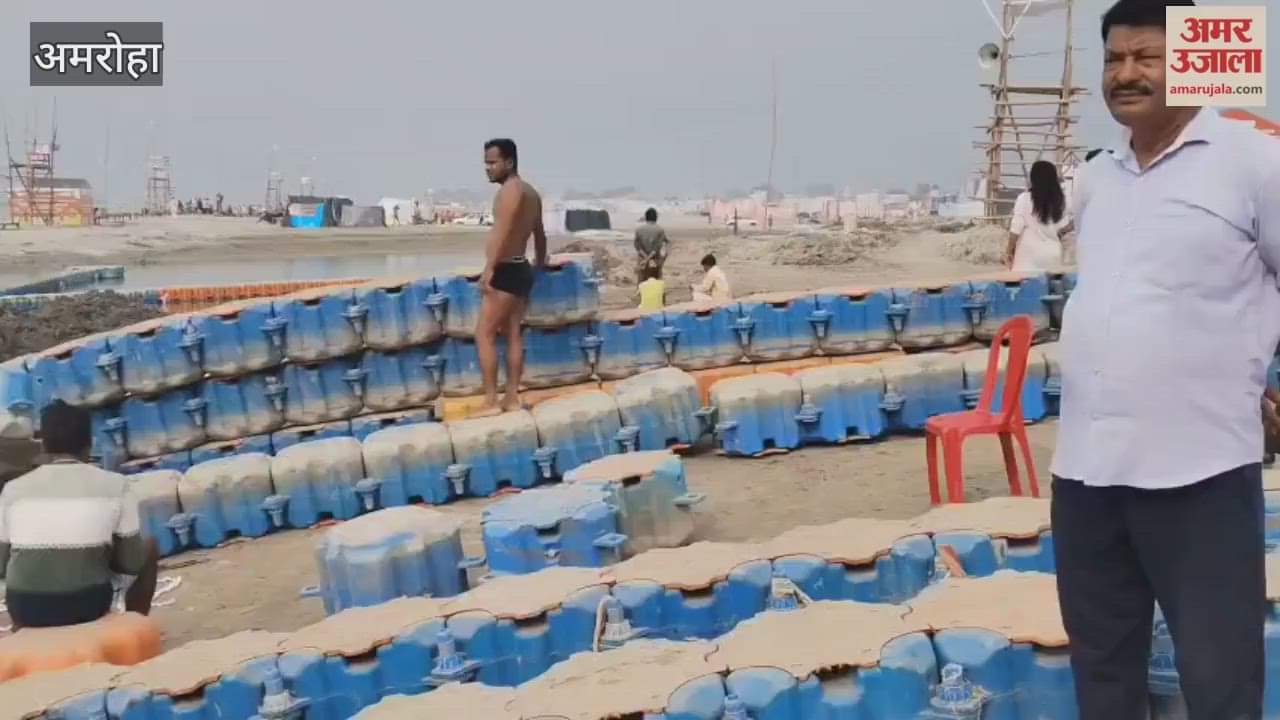 Floating barricades are being installed for the safety of devotees at the Tigri Ganga Fair