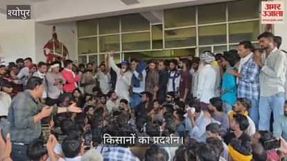 Farmers enraged by the collector's indifference, "Give compensation or resign," "Collector, come out."