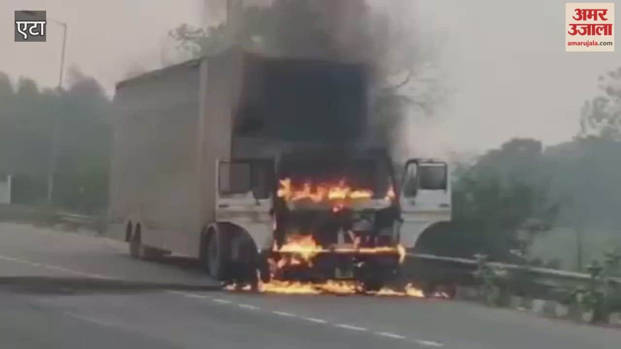 container running on road caught fire
