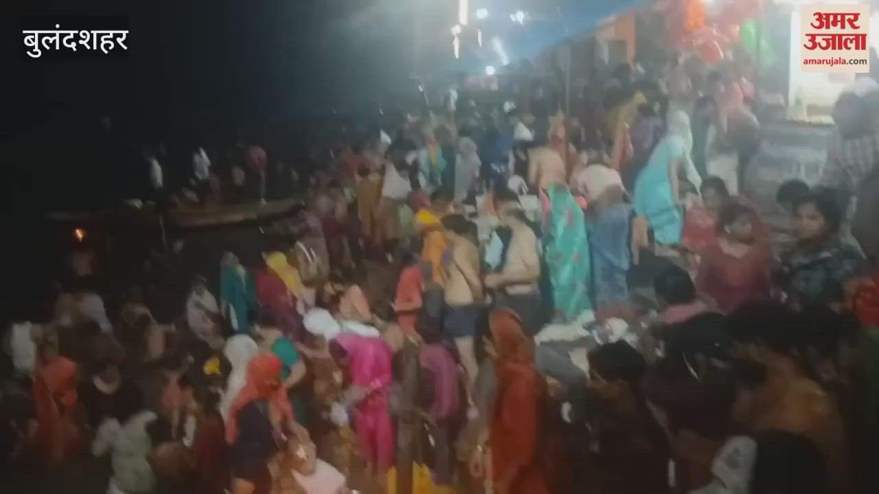 Devotees offering lamps and taking a bath in the Ganga at Anupshahr in Bulandshahr.