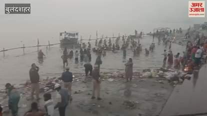 Devotees taking a bath in the Ganga at Anupshahr in Bulandshahr