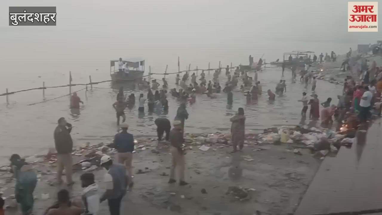 Devotees taking a bath in the Ganga at Anupshahr in Bulandshahr