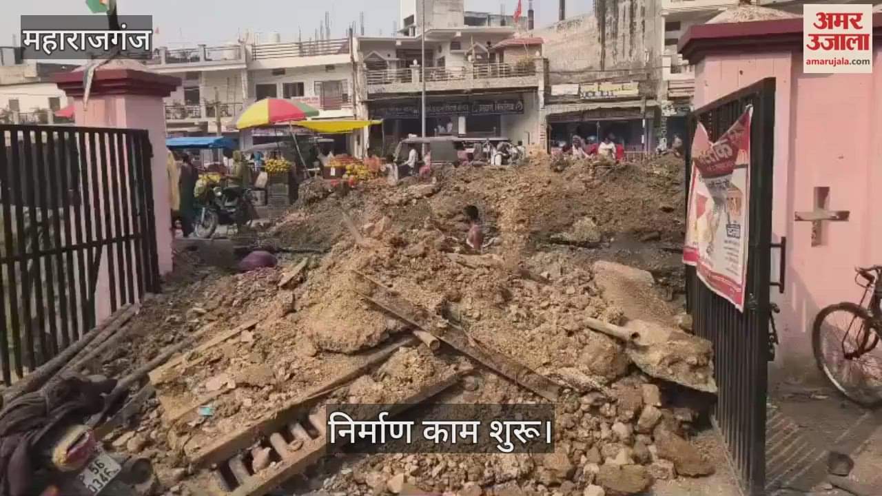 Workers engaged in repairing the drain in front of the district hospital