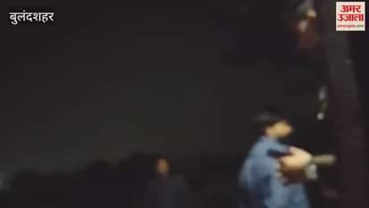 police officer filmed a man holding a pistol during a dispute between a husband and wife an investigation has begun