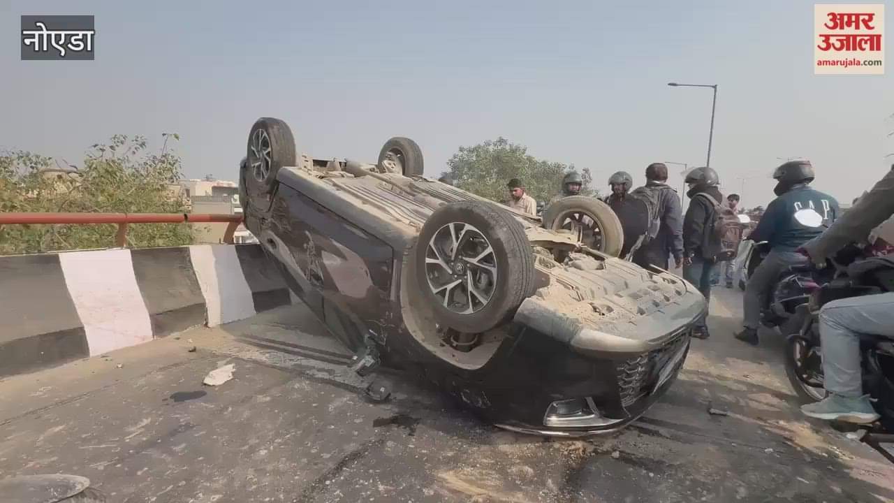 High-speed new car overturns on Noida elevated road