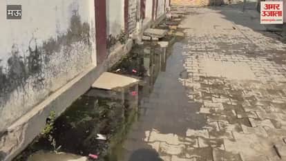 Due to lack of cleaning sewer water is on road people are troubled by filth