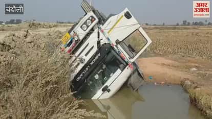 dumper loaded with red sand overturned in roadside ditch