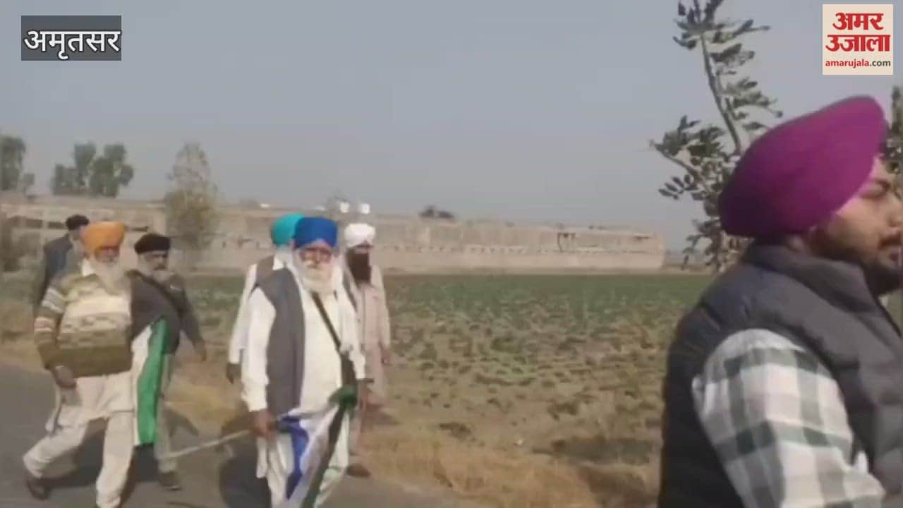Farmers sit on railway tracks in Devidas Pura, Amritsar.