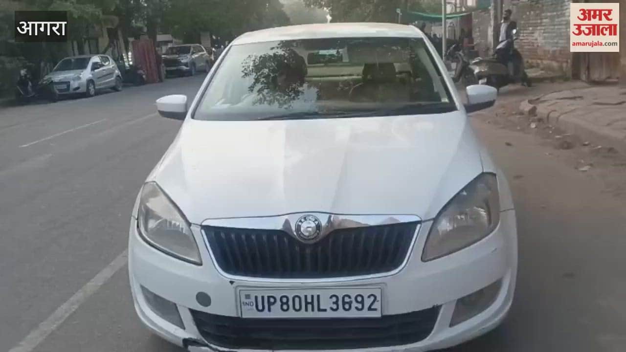 School owner driving car wearing helmet in Agra