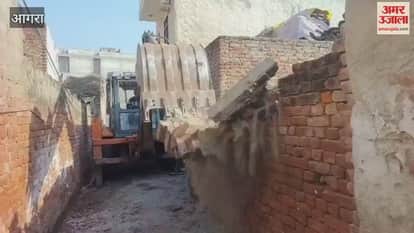 Bulldozer runs on wall that was obstructing road construction