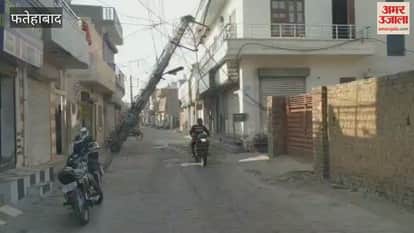 pole in Fatehabad was broken by a vehicle collision and was leaning on wires in the street.