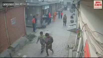 person on scooter shot woman and young man in Amritsar