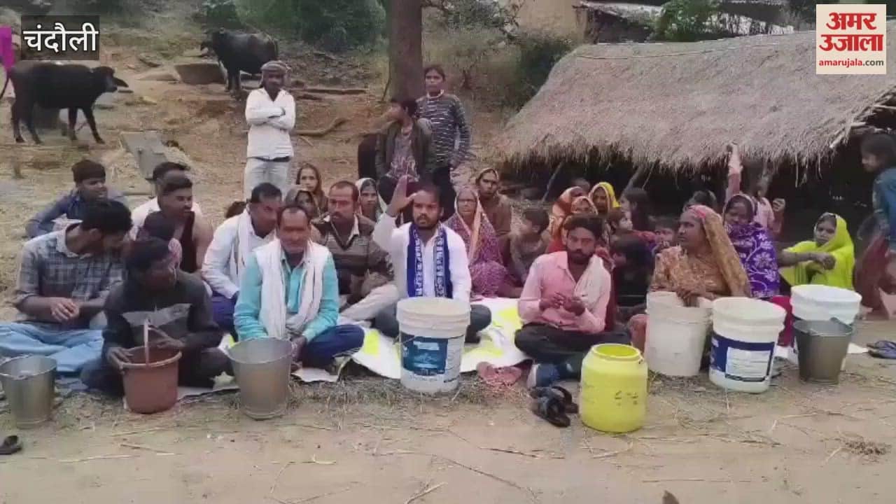 Villagers stage protest over water shortage people sit with buckets