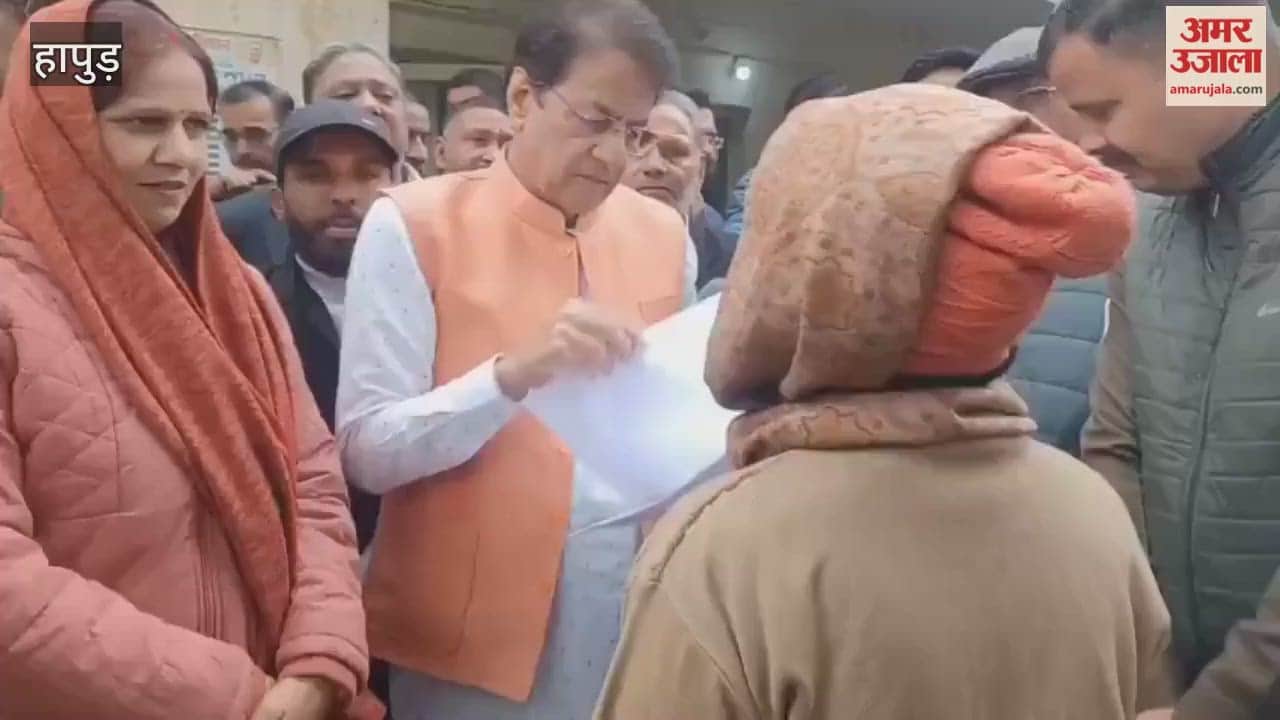 An elderly woman seeking pension pleads for help from MP Arun Govil